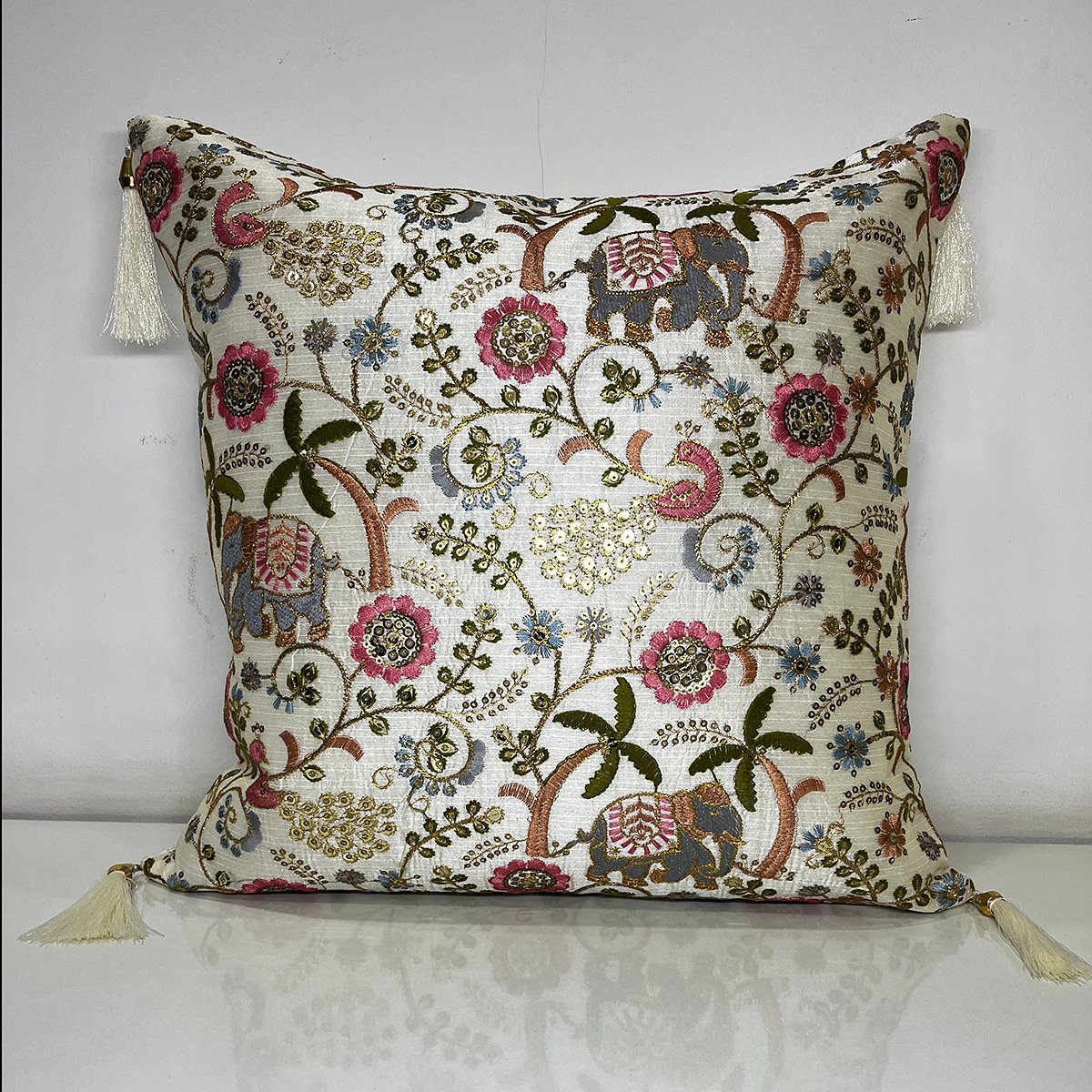 Embroidered Zara cushion cover in elephant palm, front view