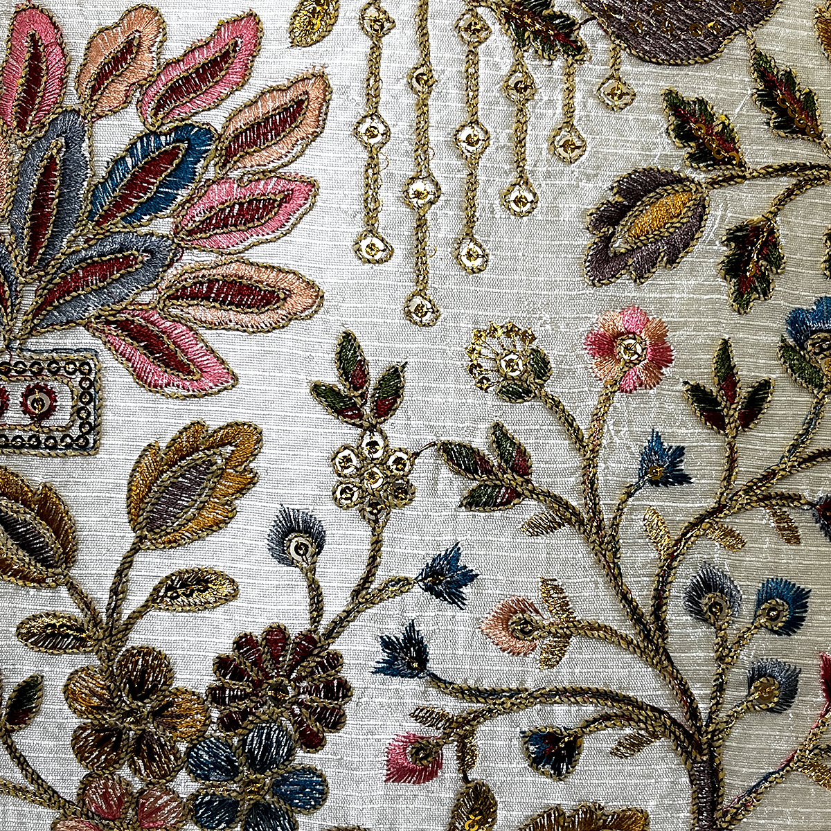 Close-up of the pastel flower embroidery