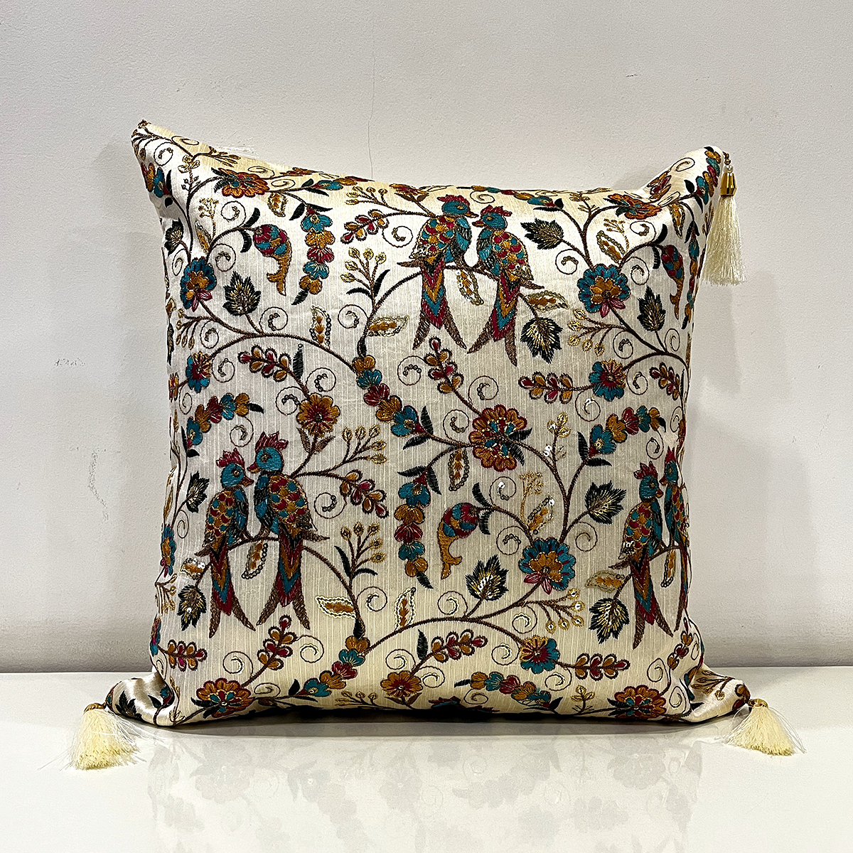 Embroidered Zara cushion cover in peacock, front view