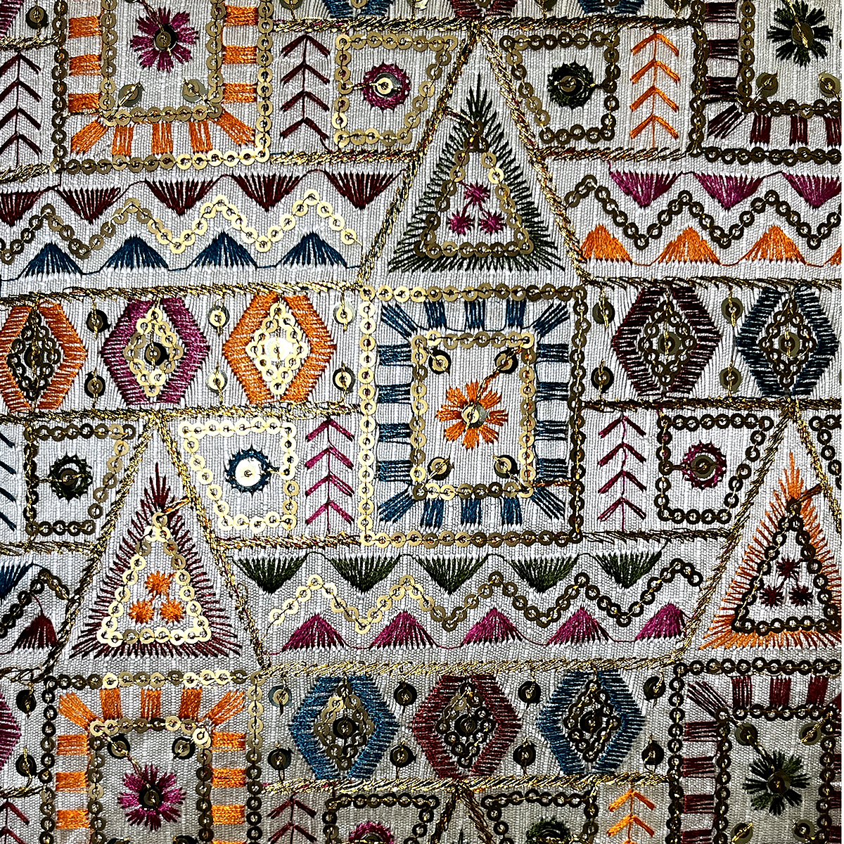 Close-up of the tribal mosaic embroidery