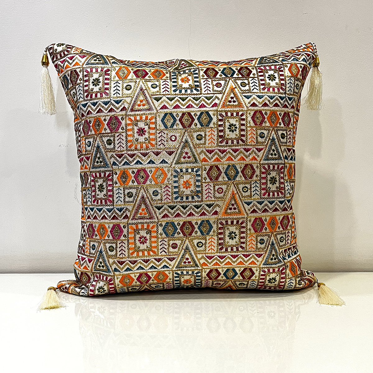 Embroidered Zara cushion cover in tribal mosaic, front view
