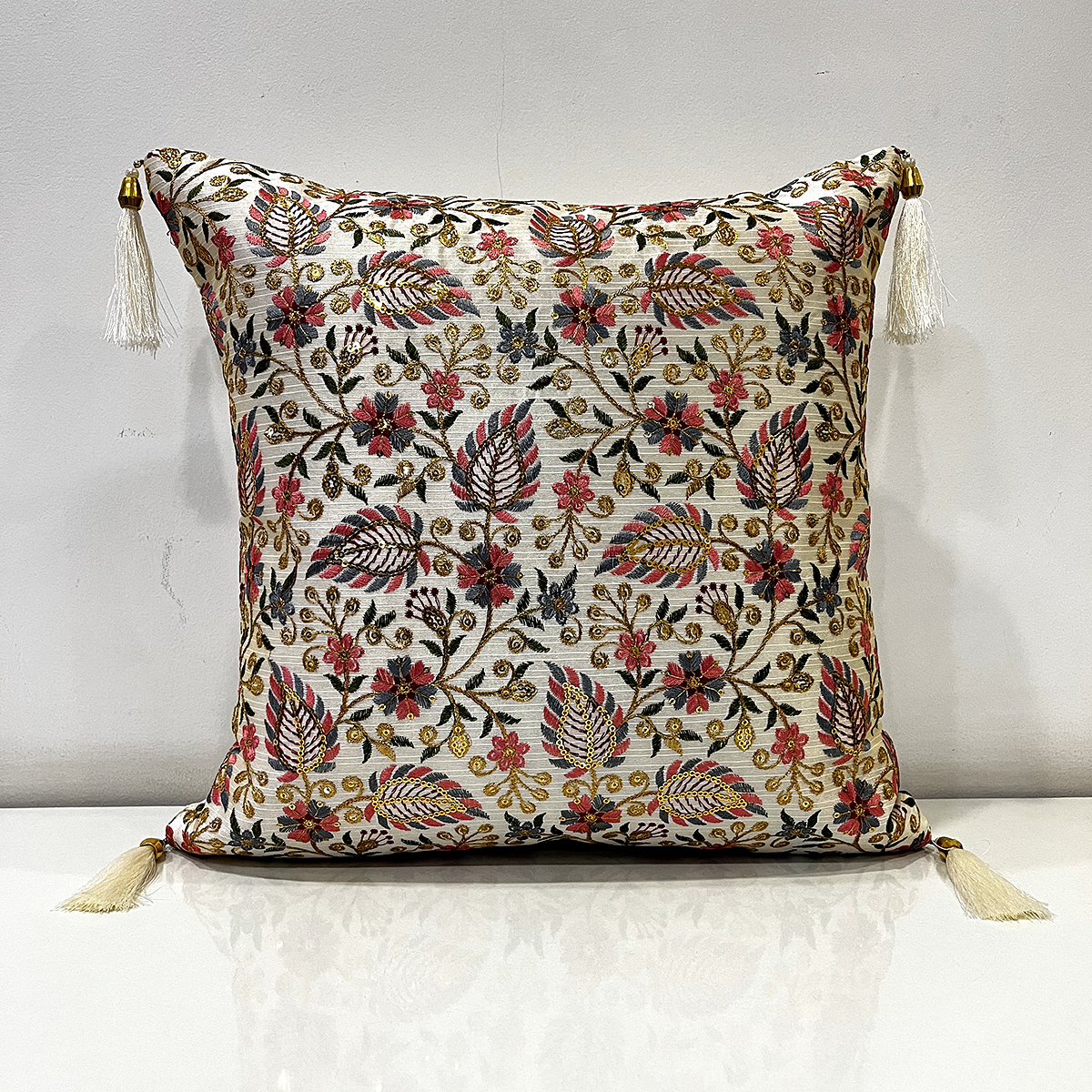 Embroidered Zara cushion cover in tropical leaf, front view