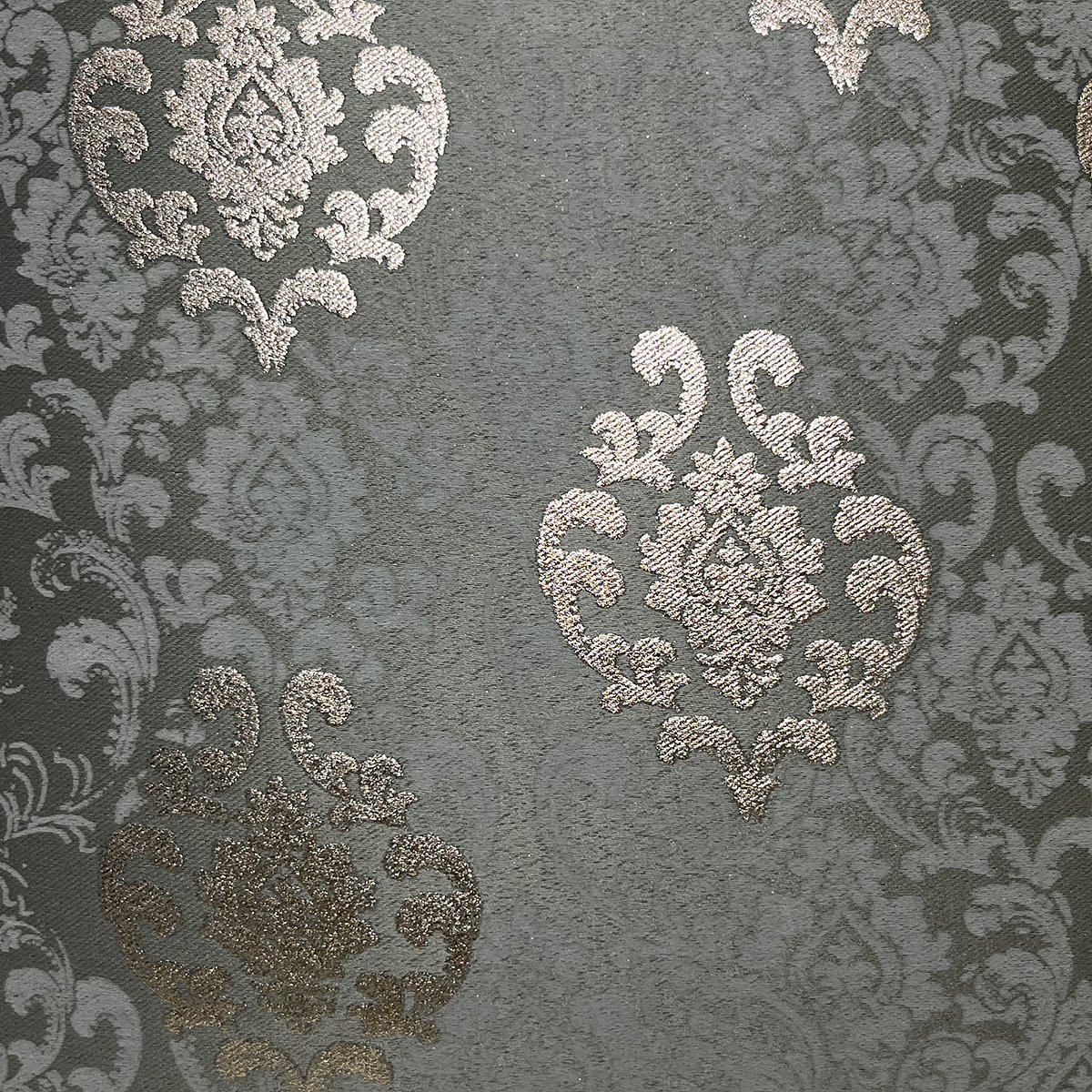 Close-up of the damask weave and gold-toned motifs in greyish blue